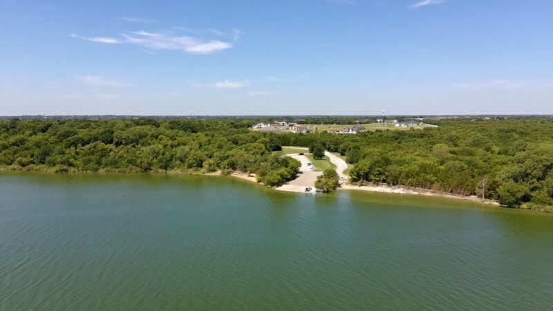 Aerial view of a lakeside residential area near Highland Park, Texas