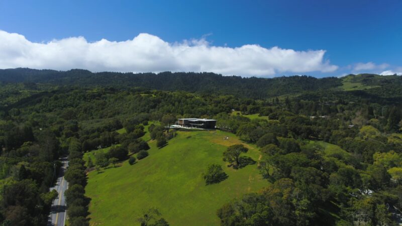 Aerial view of a large hillside home in Portola Valley, California