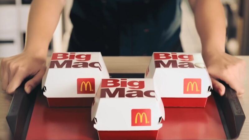 Three Big Mac boxes sit on a fast-food tray