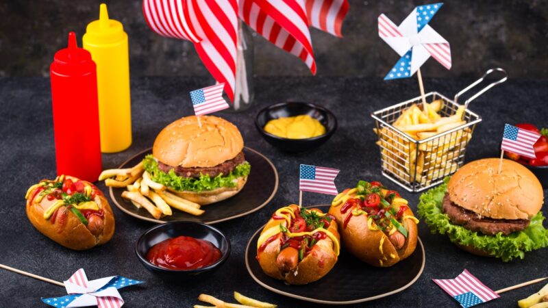American fast-food favorites including burgers, hot dogs, and fries on a table